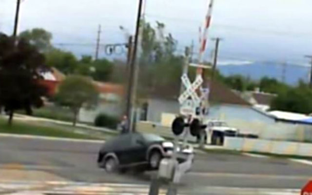 HUMP DAY JUMP Ford Expedition Bounces on Railroad Tracks