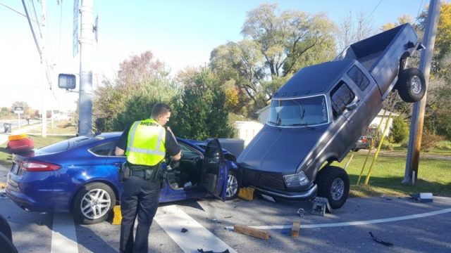 Odd News: Head-On Collision Sends Ford Truck up a Pole