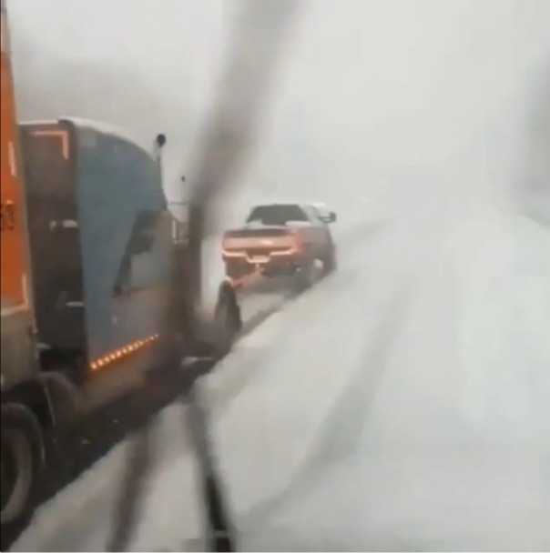 Ford Super Duty Helps Huge Tractor Trailer Climb Icy Hill!