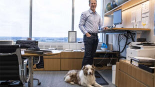 Ford CFO Chief Financial Officer Tim Stone with dog at headquarters