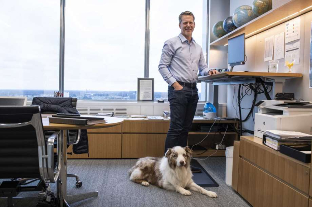 Ford CFO Chief Financial Officer Tim Stone with dog at headquarters