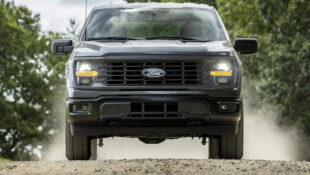 2024 Ford F-150 STX driving on dirt road