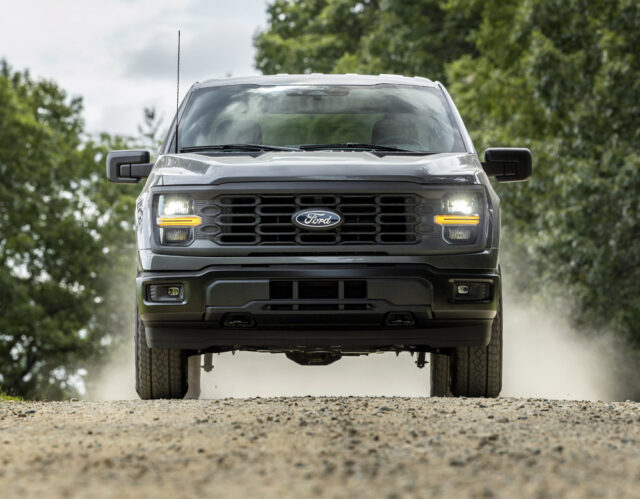 2024 Ford F-150 STX driving on dirt road